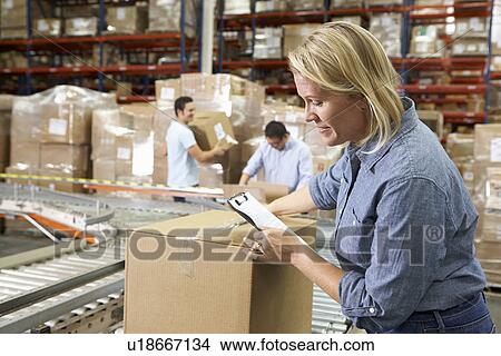 Picture - Workers In Distribution Warehouse. Fotosearch