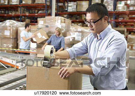 Workers In Distribution Warehouse View Large Photo Image Stock Image - Workers In Distribution Warehouse. Fotosearch