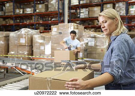 Workers In Distribution Warehouse View Large Photo Image Stock Image - Workers In Distribution Warehouse. Fotosearch