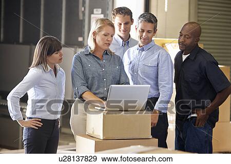 Workers In Distribution Warehouse View Large Photo Image Stock Photo - Workers In Distribution Warehouse. Fotosearch