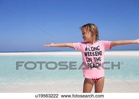 Young Girl Enjoying Beach Holiday View Large Photo Image Stock Image - Young Girl Enjoying Beach Holiday. Fotosearch