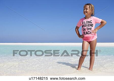 Stock Photography - Young Girl Enjoying Beach Holiday. Fotosearch