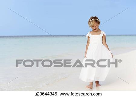 Young Girl In Bridesmaid Dress Walking On Beautiful Beach View Large Photo Image Stock Photography - Young Girl In Bridesmaid Dress Walking On Beautiful Beach . Fotosearch
