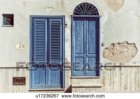 Stock Photo - Architectural detail - doors in Favignano, Sicily, Italy. Fotosearch
