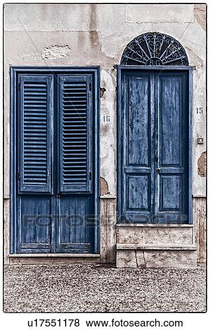 Stock Photo - Architectural detail - doors in Favignano, Sicily, Italy. Fotosearch