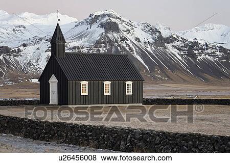 Stock Photo - Black church in winter at Budir, Snaefellnes, Iceland. Fotosearch