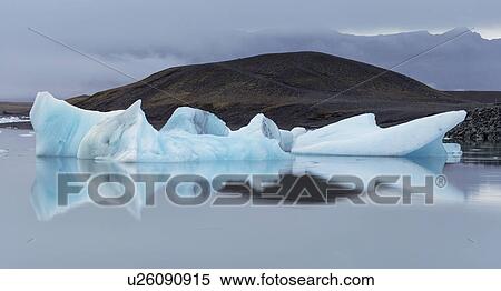 Blue iceberg at Jokulsarlon lagoon, Iceland View Large Photo Image Stock Photography - Blue iceberg at Jokulsarlon lagoon, Iceland. Fotosearch
