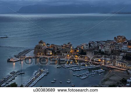 Stock Photo - Castellammare al Golfo at dawn, aerial view, Sicily, Italy. Fotosearch