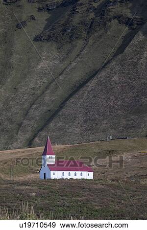 Church at Vik dwarfed by mountains, Iceland View Large Photo Image Stock Photo - Church at Vik dwarfed by mountains, Iceland. Fotosearch