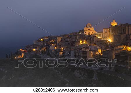 Dawn fog at hilltop town of Monterosso Almo, Sicily, Italy View Large Photo Image Stock Photograph - Dawn fog at hilltop town of Monterosso Almo, Sicily, Italy. Fotosearch
