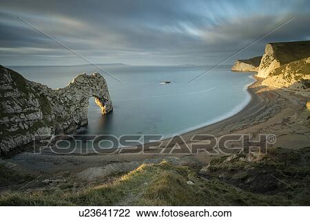 Stock Image - Durdle Door panorama at sunrise, Dorset, England. Fotosearch