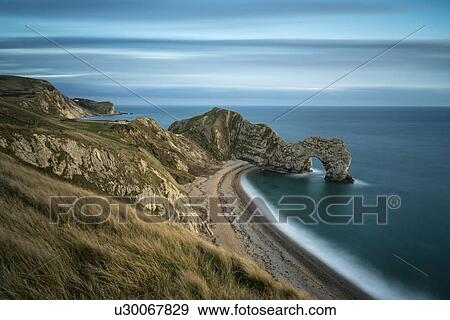 Durdle Door panorama at sunset, Dorset, England View Large Photo Image Stock Photo - Durdle Door panorama at sunset, Dorset, England. Fotosearch
