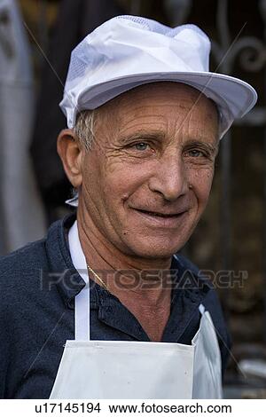 Picture - Fish vendor, Catania Fish market, Sicily, Italy. Fotosearch