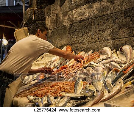 Picture - Fish vendor, Catania Fish market, Sicily, Italy. Fotosearch