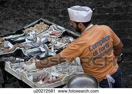Fish vendor, Catania Fish market, Sicily, Italy View Large Photo Image Stock Image - Fish vendor, Catania Fish market, Sicily, Italy. Fotosearch