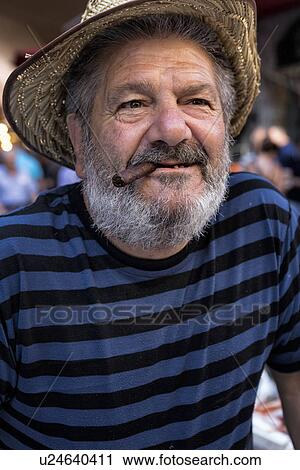 Stock Image - Fish vendor, Catania Fish market, Sicily, Italy. Fotosearch