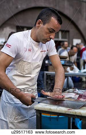 Fish vendor, Catania Fish market, Sicily, Italy View Large Photo Image Stock Image - Fish vendor, Catania Fish market, Sicily, Italy. Fotosearch