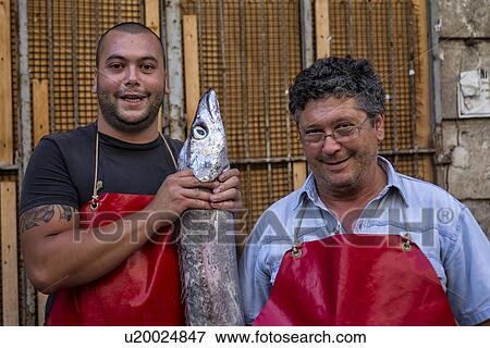 Fish vendor, Catania Fish market, Sicily, Italy View Large Photo Image Stock Photo - Fish vendor, Catania Fish market, Sicily, Italy. Fotosearch