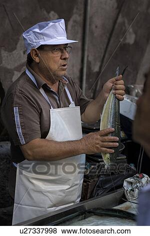 Stock Photo - Fish vendor, Catania Fish market, Sicily, Italy. Fotosearch