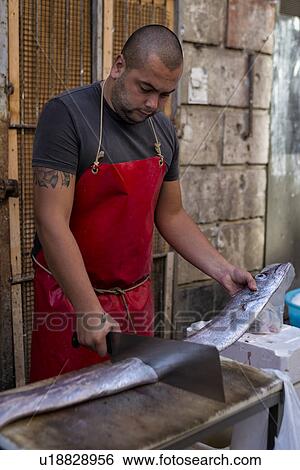 Fish vendor, Catania Fish market, Sicily, Italy View Large Photo Image Stock Photograph - Fish vendor, Catania Fish market, Sicily, Italy. Fotosearch