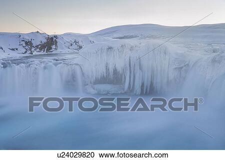 Stock Image - Godafoss waterfall frozen in winter, Iceland. Fotosearch
