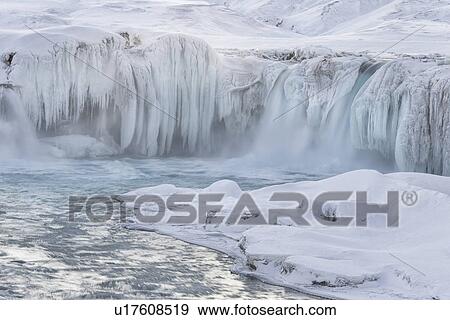 Stock Photo - Godafoss waterfall frozen in winter, Iceland. Fotosearch