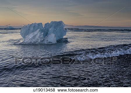 Iceberg at Jokulsarlon beach, sunrise, Iceland View Large Photo Image Stock Photo - Iceberg at Jokulsarlon beach, sunrise, Iceland. Fotosearch