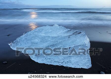 Picture - Iceberg at Jokulsarlon beach, sunset, Iceland. Fotosearch