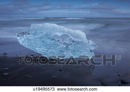 Iceberg at Jokulsarlon beach, sunset, Iceland View Large Photo Image Stock Image - Iceberg at Jokulsarlon beach, sunset, Iceland. Fotosearch
