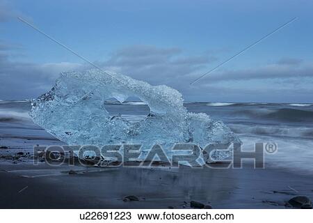 Iceberg at Jokulsarlon beach, sunset, Iceland View Large Photo Image Stock Image - Iceberg at Jokulsarlon beach, sunset, Iceland. Fotosearch