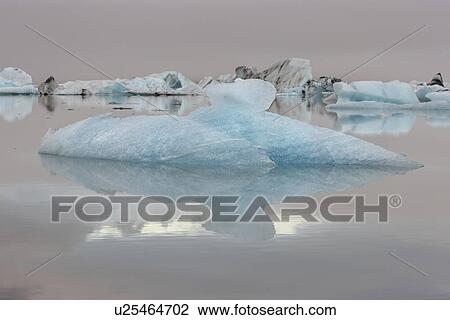 Iceberg detail with reflection, Jokulsarlon lagoon sunrise, Icel View Large Photo Image Stock Image - Iceberg detail with reflection, Jokulsarlon lagoon sunrise, Icel. Fotosearch