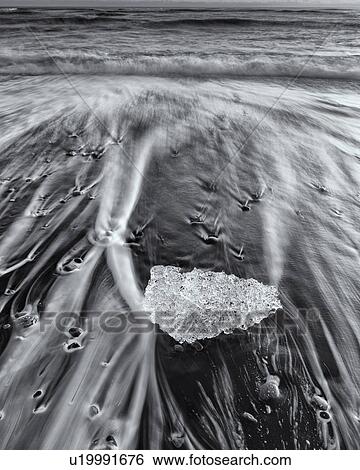 Stock Photograph - Iceberg on beach, Jokulsarlon, Iceland. Fotosearch