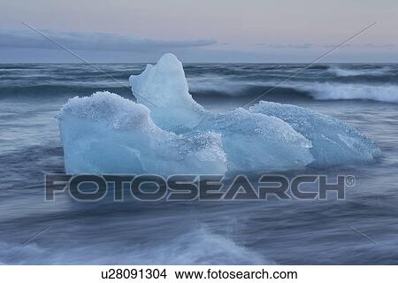Picture - Icebergs at Jokulsarlon beach, sunset, Iceland. Fotosearch
