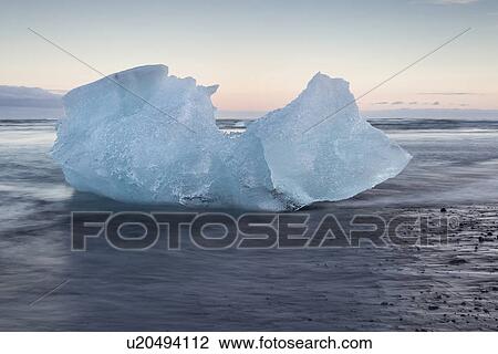 Icebergs at Jokulsarlon beach, sunset, Iceland View Large Photo Image Stock Image - Icebergs at Jokulsarlon beach, sunset, Iceland. Fotosearch