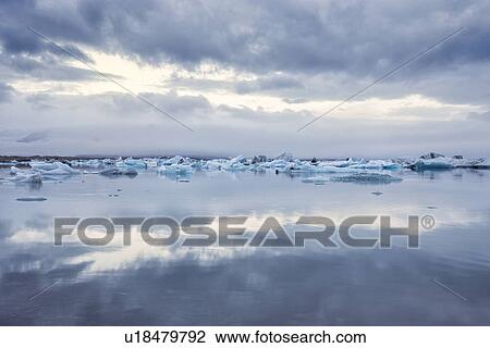 Stock Image - Icebergs at Jokulsarlon lagoon sunrise, Iceland. Fotosearch