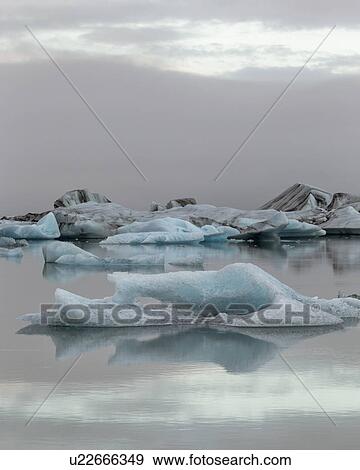 Icebergs at Jokulsarlon lagoon sunrise, Iceland View Large Photo Image Stock Photo - Icebergs at Jokulsarlon lagoon sunrise, Iceland. Fotosearch