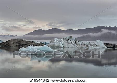 Icebergs at Jokulsarlon lagoon, with glacier, sunrise, Iceland View Large Photo Image Stock Image - Icebergs at Jokulsarlon lagoon, with glacier, sunrise, Iceland. Fotosearch