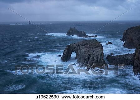 Stock Image - Land's End in stormy seas, Cornwall, England. Fotosearch