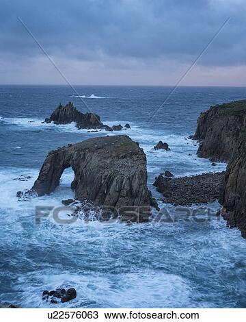 Stock Image - Land's End in stormy seas, Cornwall, England. Fotosearch
