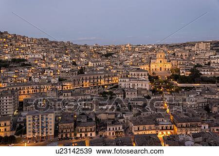 Stock Photo - Modica aerial twilight view, Sicily, Italy. Fotosearch