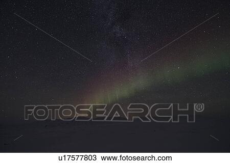 Stock Image - Northern lights and Milky Way over Dimmifjallgardur, Iceland. Fotosearch