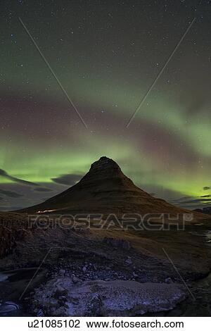 Stock Image - Northern lights over Kirkjufell mountain, Grundarfjordur, Snaef. Fotosearch