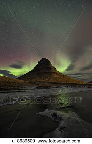 Stock Photo - Northern lights over Kirkjufell mountain, Grundarfjordur, Snaef. Fotosearch