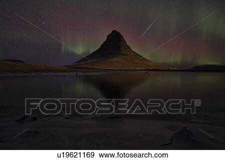 Stock Photo - Northern lights over Kirkjufell mountain, Snaefellnes, Iceland. Fotosearch