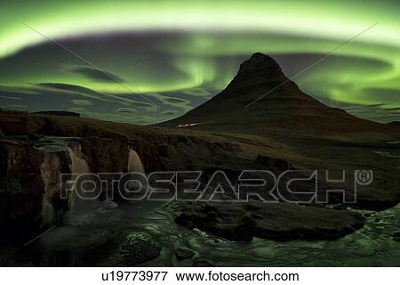 Stock Photo - Northern lights over Kirkjufell mountain, Grundarfjordur, Snaef. Fotosearch