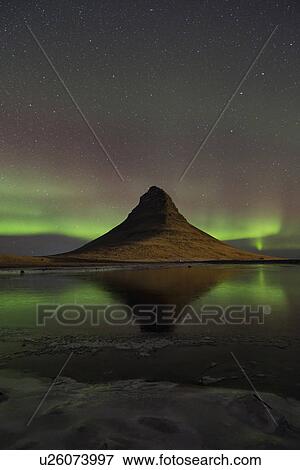 Stock Photo - Northern lights over Kirkjufell mountain, Snaefellnes, Iceland. Fotosearch
