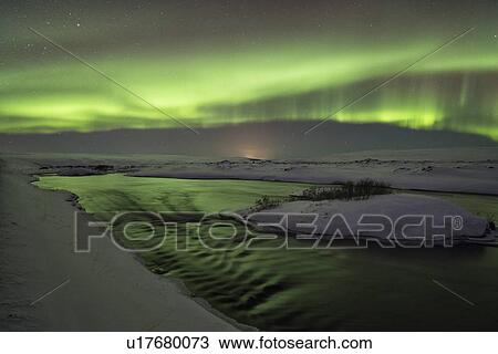 Stock Image - Northern lights over Myvatn river, Iceland. Fotosearch