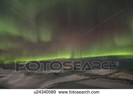 Stock Photo - Northern lights over Myvatn volcanic caldera, Iceland. Fotosearch