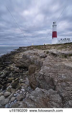 Stock Photo -  Portland Bill in moody sunrise, Dorset, England. Fotosearch