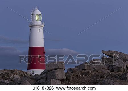 Stock Photograph - Portrait of Portland Bill in sunset light, Dorset, England. Fotosearch